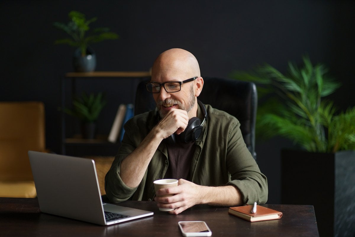A professional considering a complex decision during a confidential consultation