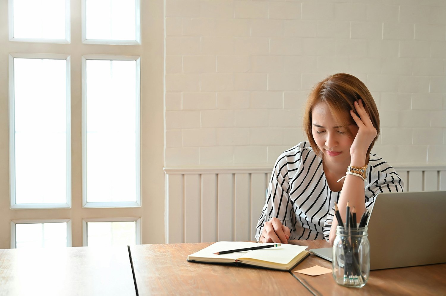 Female healthcare professional appearing distressed