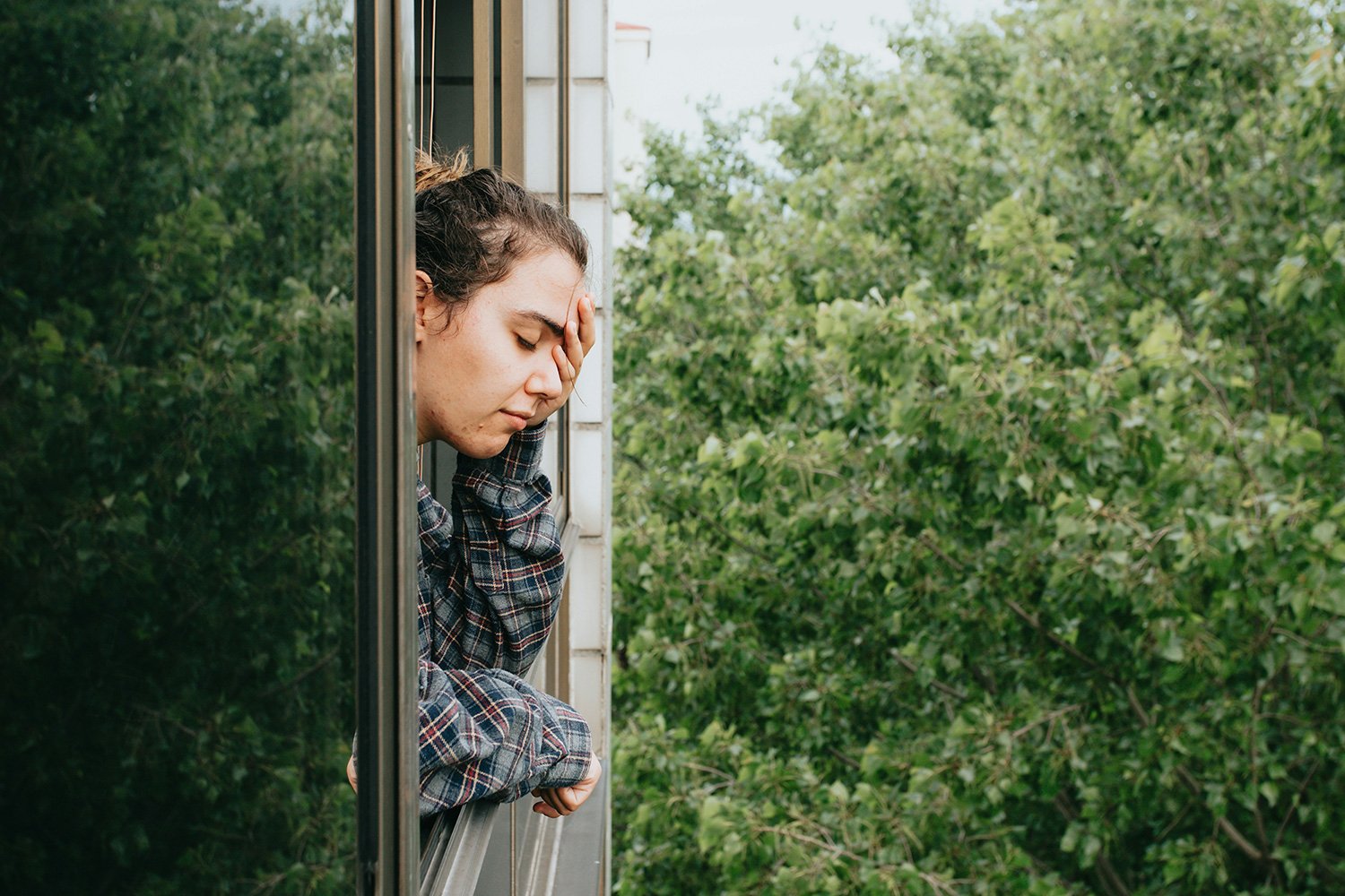 Exhausted woman resting her head in her hand